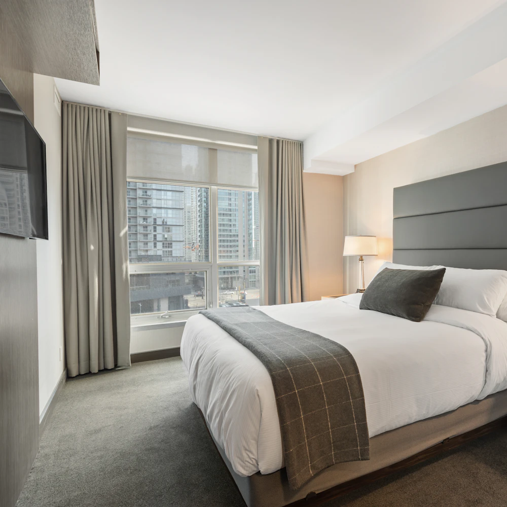 Modern city hotel room with a downtown skyline view