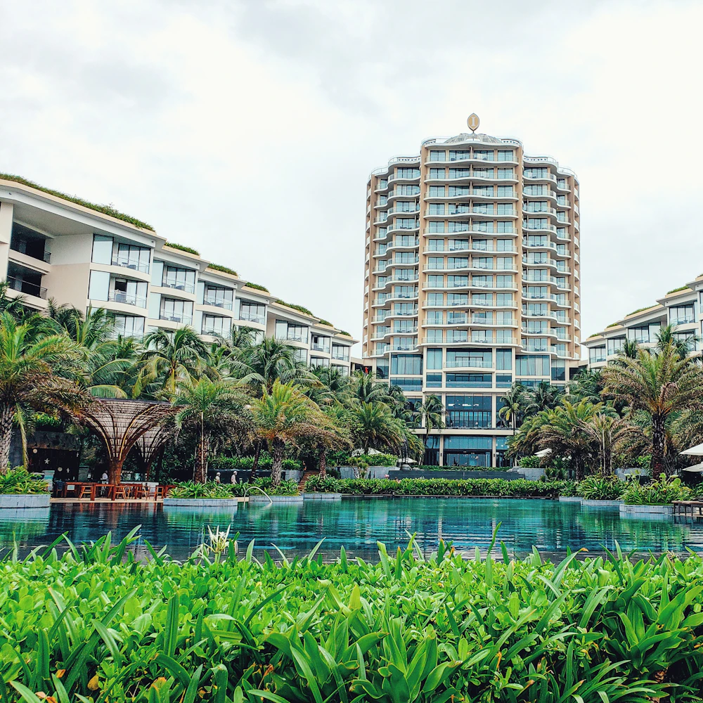 Multi-building hotel complex around a shared lagoon pool
