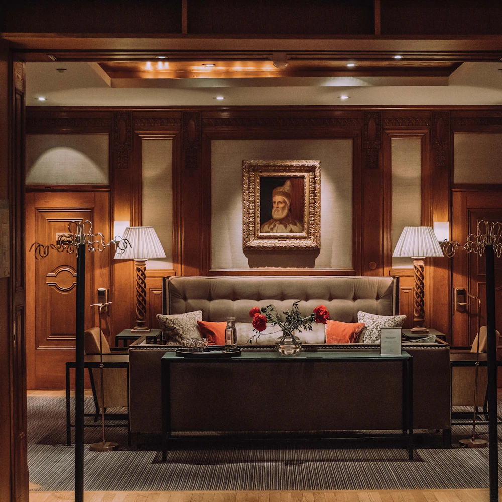Wood-panelled lounge of an independent heritage hotel