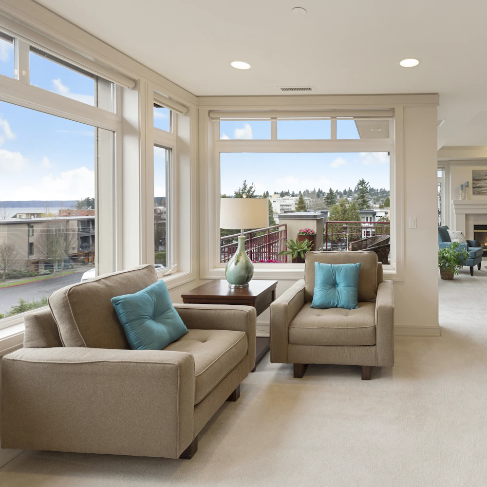 Bright serviced apartment living room with corner windows